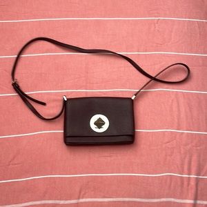 Kate spade Crossbody Newish condition deep burgundy to brown with gold accents